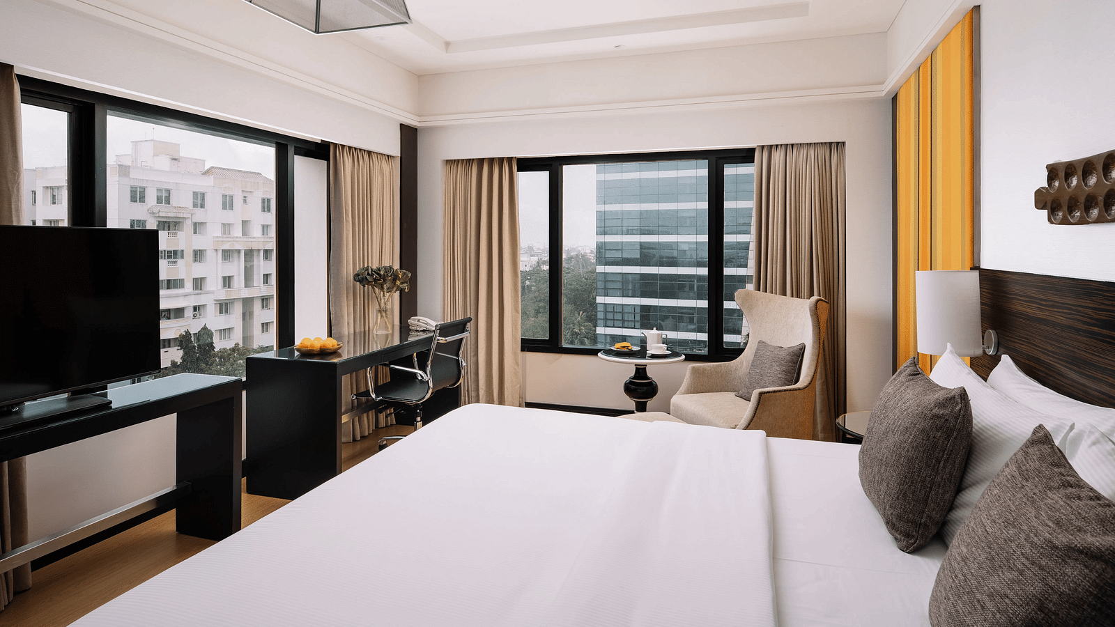 Image of Deluxe Room at The Raintree St. Mary s Road with a bed and a sofa