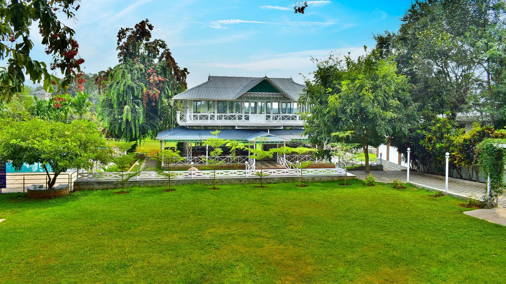 picture of a Huge building with a lawn in the front captured in  the day time