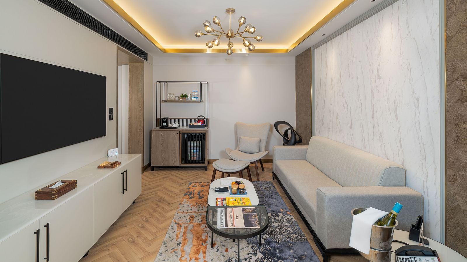Well-appointed Nirvana Suite offering a dedicated workspace, a cosy seating area, and a convenient kitchenette  - Nirvana Luxury Hotel, Ludhiana
