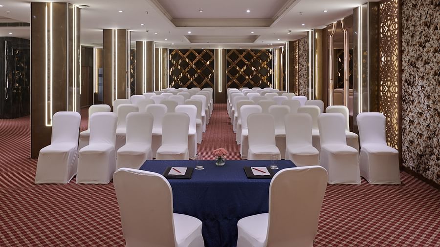 An image of a banquet hall with the chairs arranged in classroom type seating - Deventure Sarovar Portico, Patel Nagar