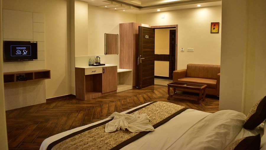 Deluxe Room - a pristine white bed with soft linens and clean pillows designed with soft lights and aesthetic interior2 - Hotel Montana Vyoo