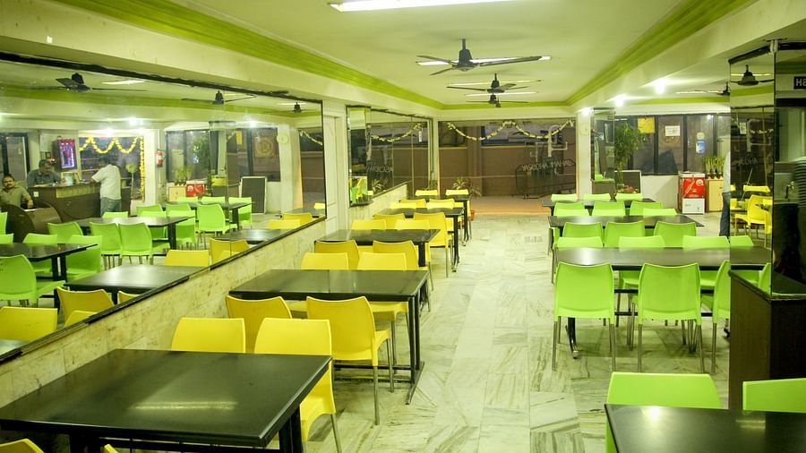  Hotel Yasodha Towers - Interior view of the restaurant featuring ceiling fans and numerous seating options