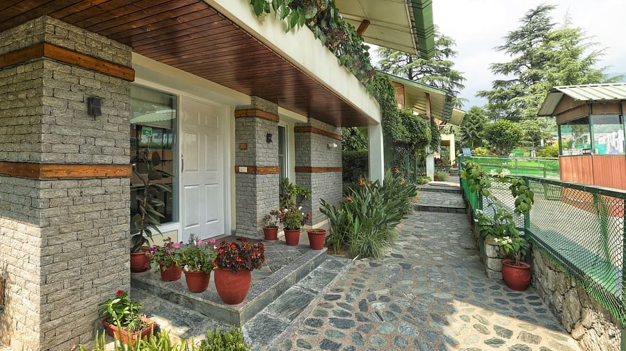 Exterior view of parking area and entrance to villas at lamrin norwood green captured during the day