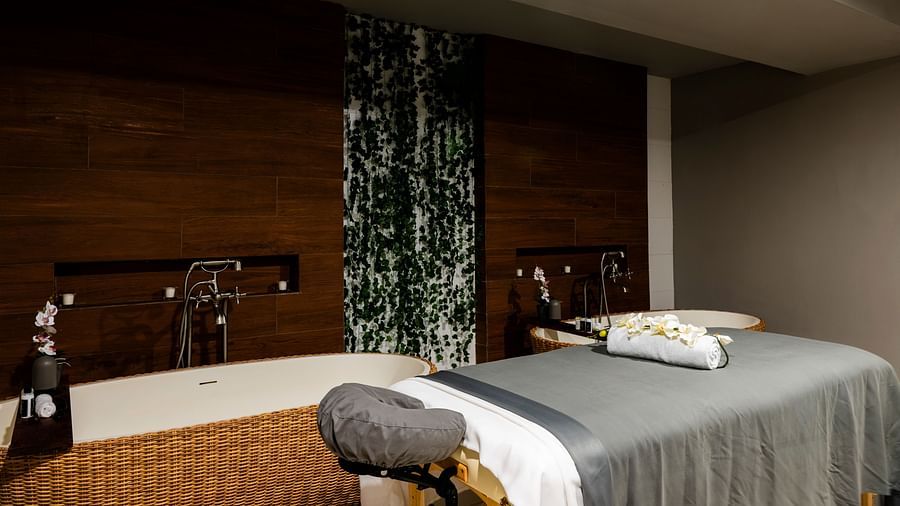 A treatment room in our spa in Montego Bay with a bed - S Hotel Montego Bay, Jamaica