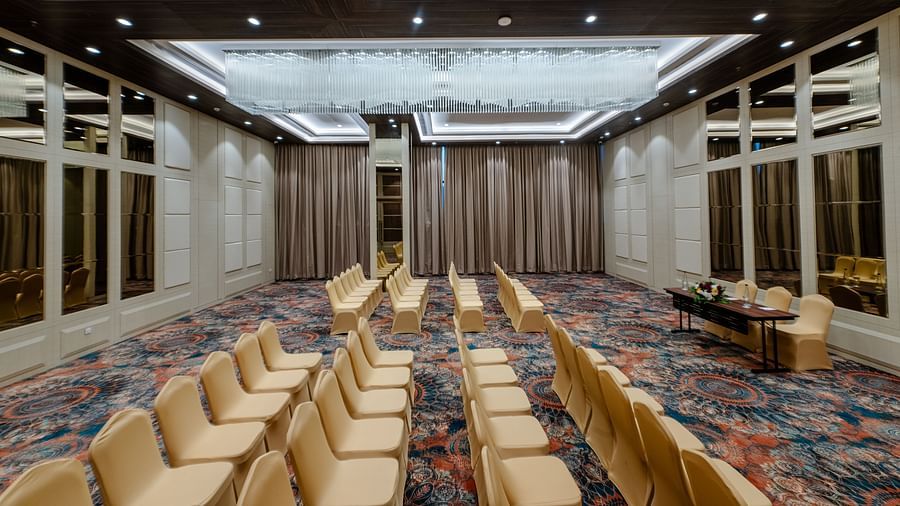 A theatre style arrangement in a banquet hall in Ajmer with carpeted floors - Sarovar Portico, Ajmer