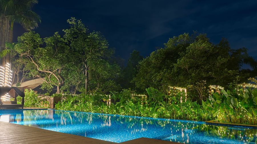 an image of a swimming pool surrounded by the garden in the evening at The Dukes Retreat