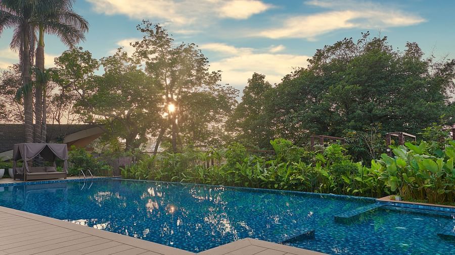 sunset view by the pool, with vibrant colours reflecting on the water at The Dukes Retreat