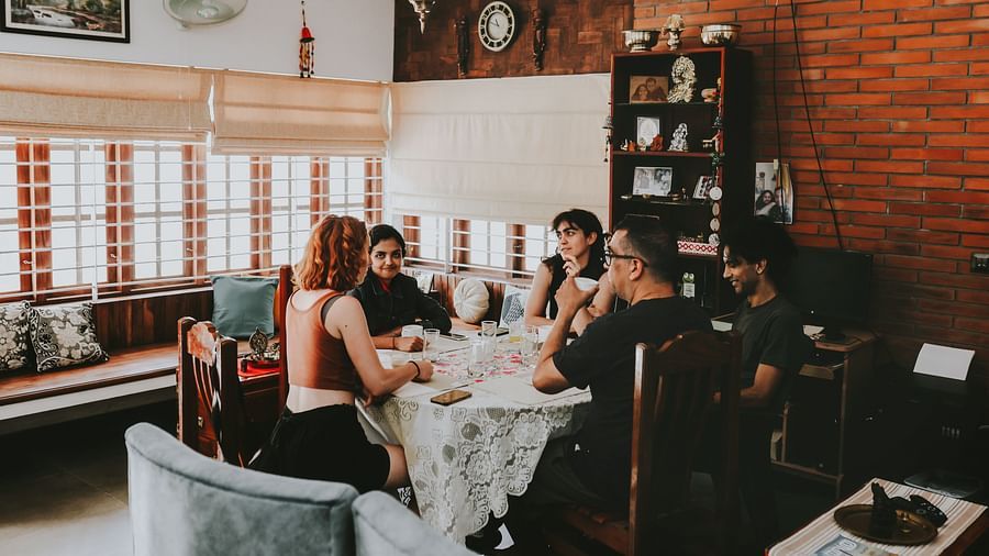 View of people sitting and chitchatting in the Living Room at Ananda Holiday Home, Wayanad 5