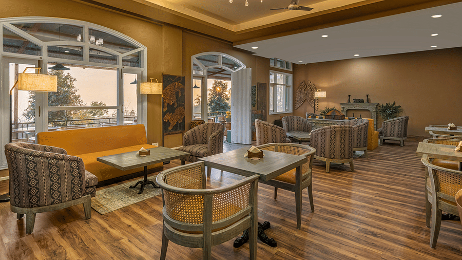 An image of Atman, dharamshala restaurant interior with elegant decor and comfortable seating.