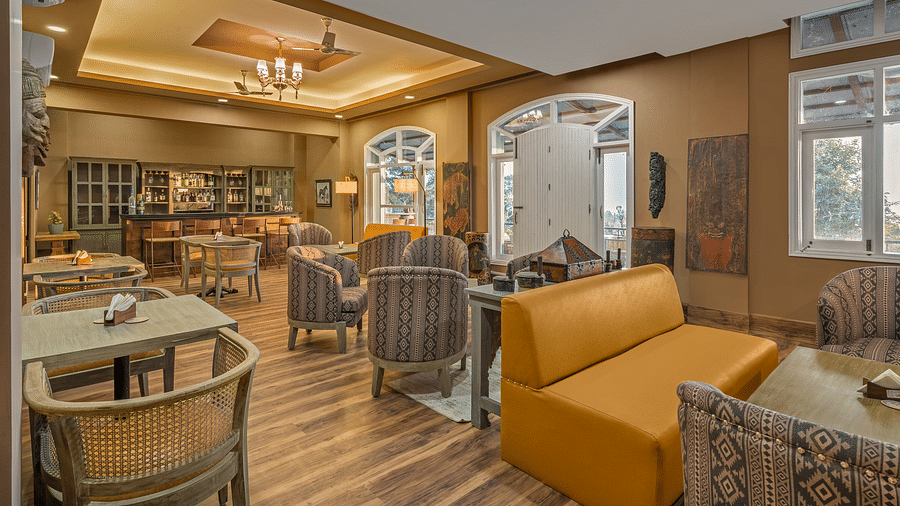view of a lounge with sofas and chairs placed around tables in clusters - Atman, Dharamshala