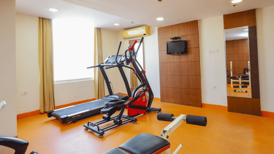 A hotel fitness centre with a treadmill and exercise bike - Hyphen Grand, Haridwar