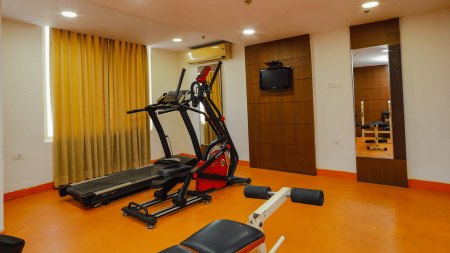 Another angle of the hotel fitness centre with a treadmill and elliptical machine - Hyphen Grand, Haridwar
