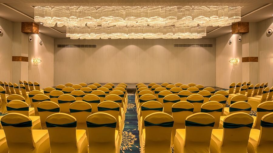Yellow coloured chairs in the Sumo Anaika Banquet Hall at Le Foliage by TGI, Bangalore