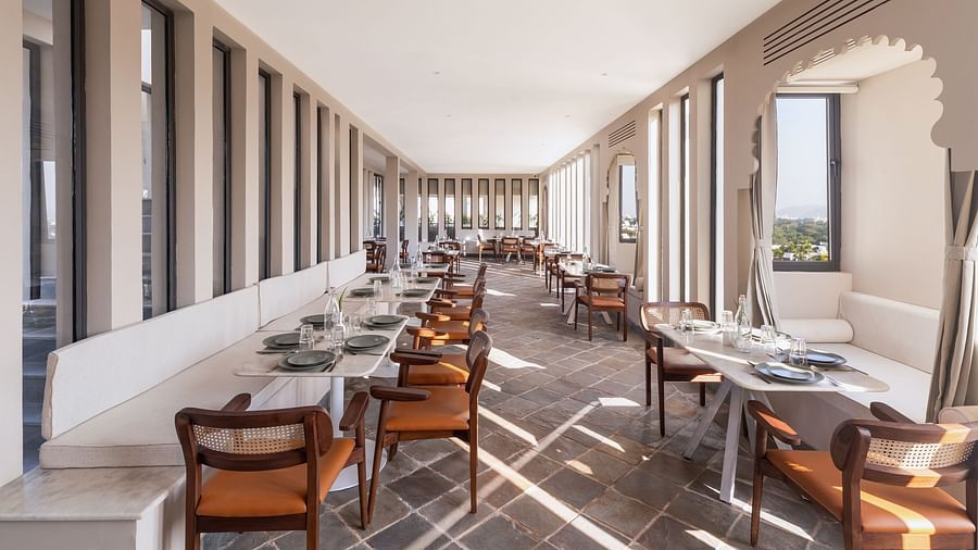 Seating arrangements inside a restaurant at Manuscript - Jhilwara Haveli, Udaipur