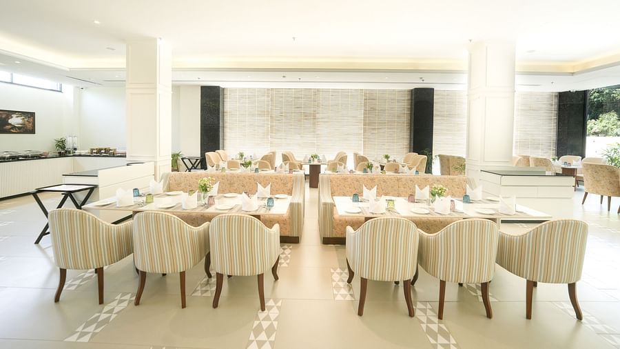 An image of our expansive restaurant in Bankhandi, featuring large dining tables, cosy furniture, and a buffet area - NAMAMI BY ZENQ BANKHANDI