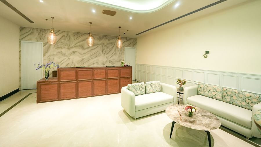 A modern reception area with sleek white sofas and a minimalist vibe - NAMAMI BY ZENQ BANKHANDI