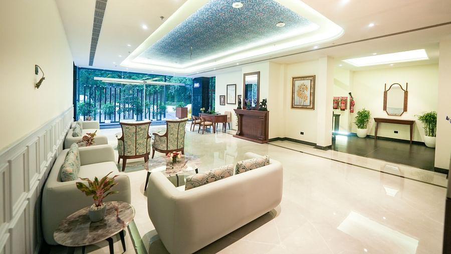 An image of a hotel lobby with cosy sofas, upholstered chairs, and a reception desk - NAMAMI BY ZENQ BANKHANDI