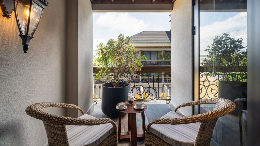 2 arm chairs kept on the balcony of the Executive Room along with a small coffee table at The Evren, Vagator.