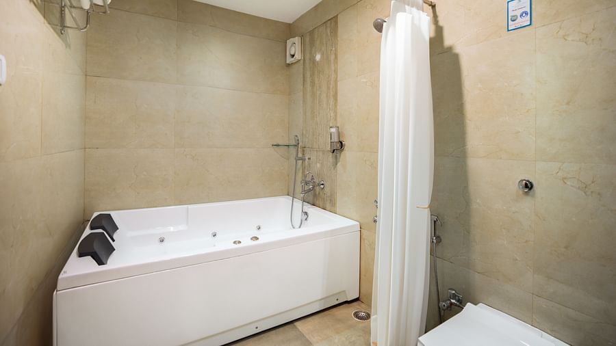 Image of a bathtub in a well equipped washroom of the resort | The Grand Legacy Resort and Spa