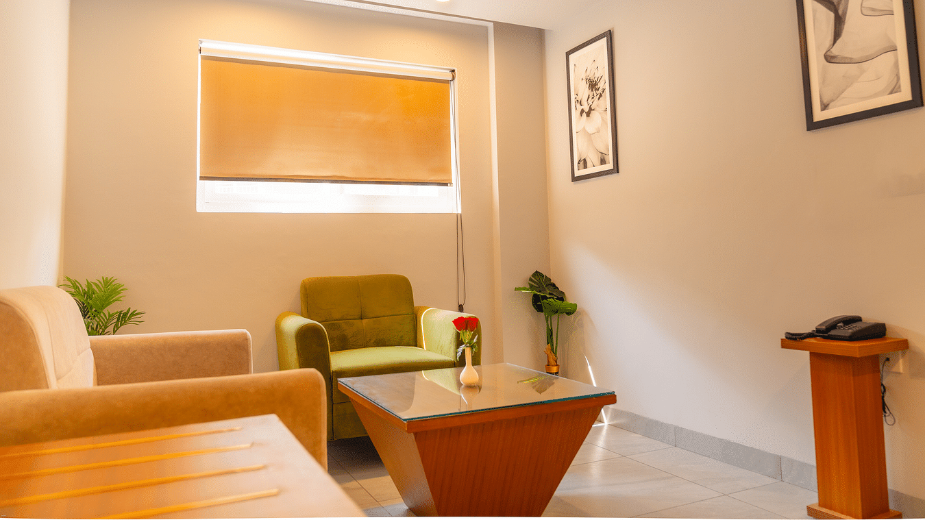 Living area of a Deluxe Room with comfortable sofas at Montclair Ananta, Elite.