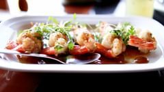 A plate of seafood placed on a surface at Heritage Village Resort & Spa, Goa.