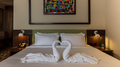 casa tropicana room with a king size bed and towel art at Symphony Samudra Beachside Jungle Resort And Spa, Port Blair