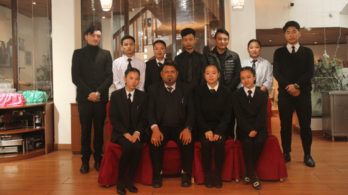 A group of professional looking people posing for a group picture