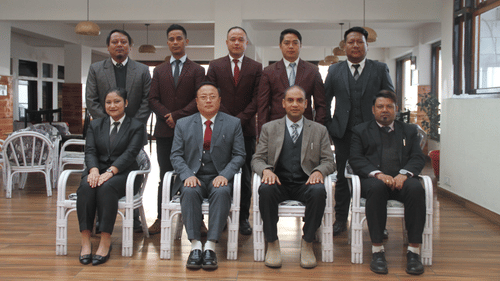 A group of professional looking people posing for a photo