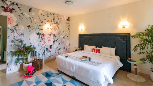 An overview of a bedroom with a double bed inside it - Karma Lakelands.