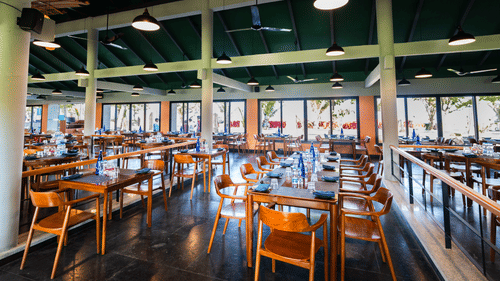 Cosy corner seating at Song of the Sea, MGM Beach Resorts – indoor dining area with beachfront views and a relaxed atmosphere