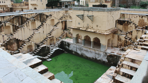 an old fort with a pool or bathing area