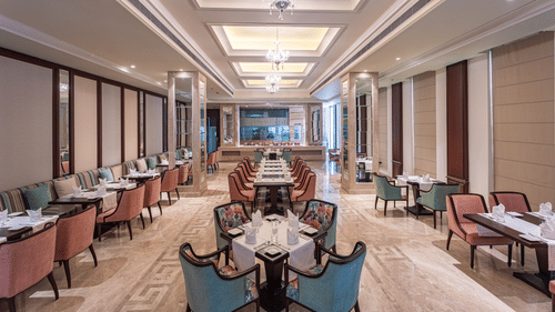rows of tables and chairs in our restaurant in Jalandhar - Park Plaza, Jalandhar