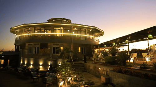 outdoor dining at dusk - Polo Cherrapunjee Resort