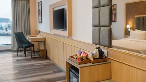 Work desk and refreshment counter in the Superior Room at Sarovar Portico, Ajmer