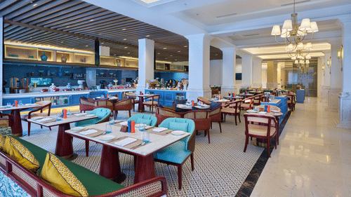 Luxurious dining setup featuring colourful accents and spacious seating - Sarovar Premiere, Amritsar