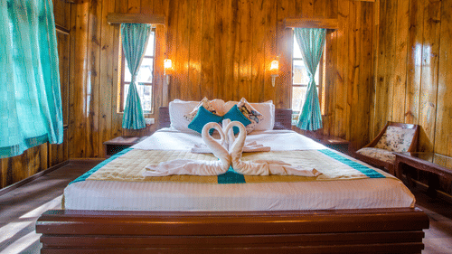 A king size bed bed with swan shaped towels