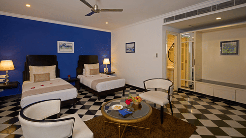 image of heritage classic rooms with twin beds at the old court house by abad, fort kochi