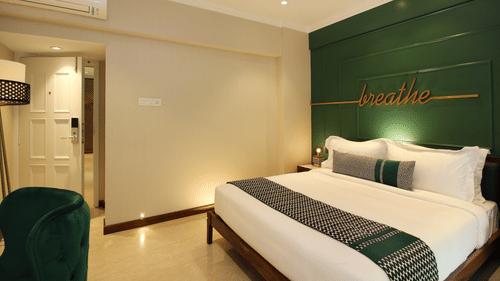 rooms with a king bed and modern interiors at theory9 bandra