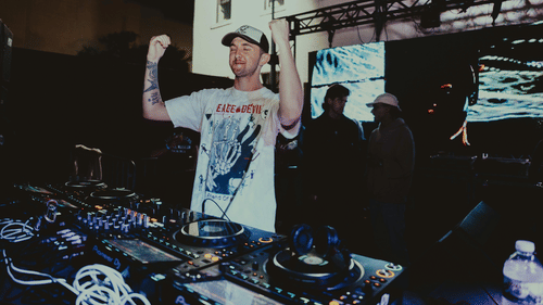 A DJ Playing at an EDM event