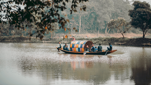 traditional shikhara lake surrounded by trees and lush green trees.