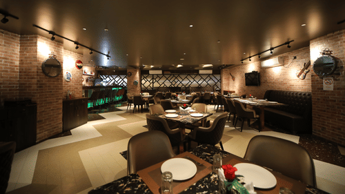 Seating arrangements inside the bar & restaurant with modern interiors - VITS Bharat Nanded