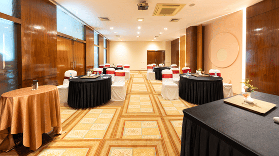 A hall with several decorated tables and a checkered floor. |  MGM Mark Whitefield