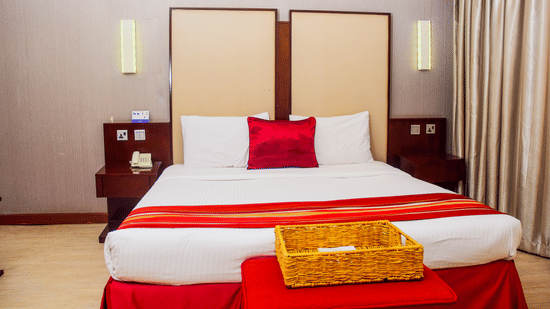 The Superior Room at The Zehneria, Nairobi featuring a double bed and warm lighting.