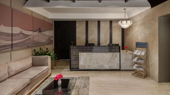 Reception desk and lobby at Voyage Milestone Hotel and Banquet.