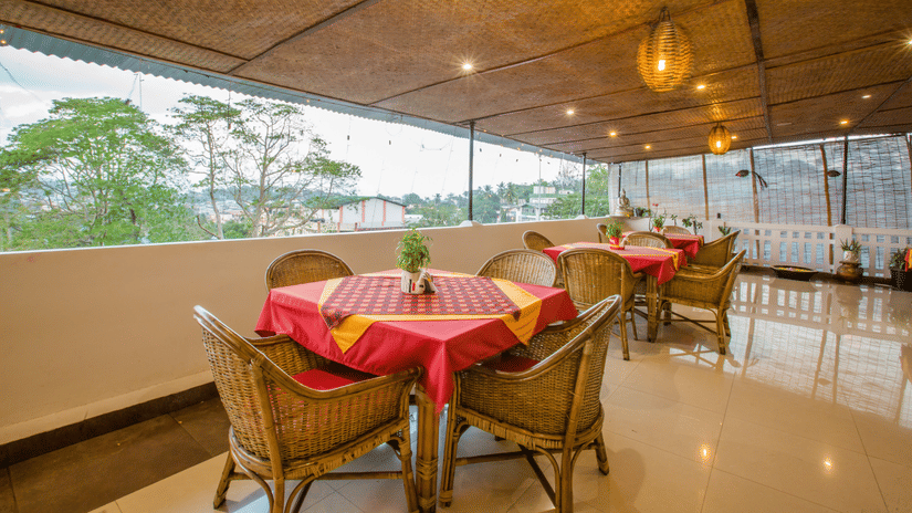  Andaman Kitchen, offering best food in Port Blair, featuring rooftop seating and area and lush green outdoor views at Hotel Shompen.