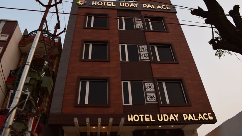 A scenic exterior view of Hotel Uday Palace, the best hotel in Varanasi, set against the sky.