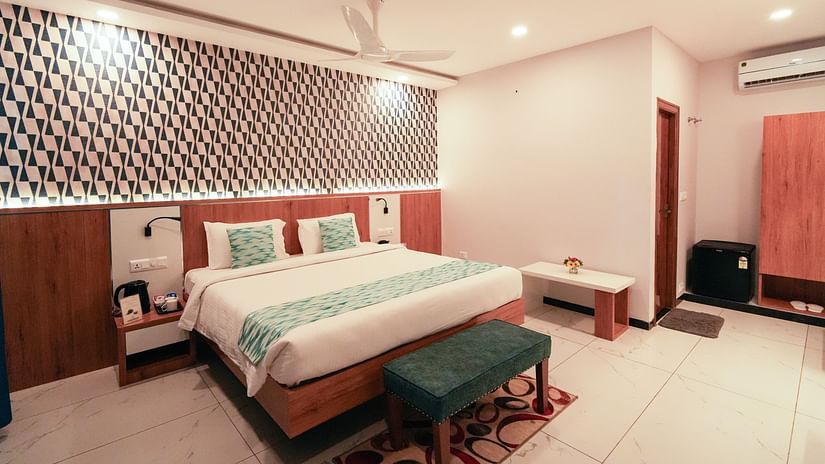 A spacious and inviting bedroom with a large bed and elegant decor -  MGM Whispering Wind's Resorts