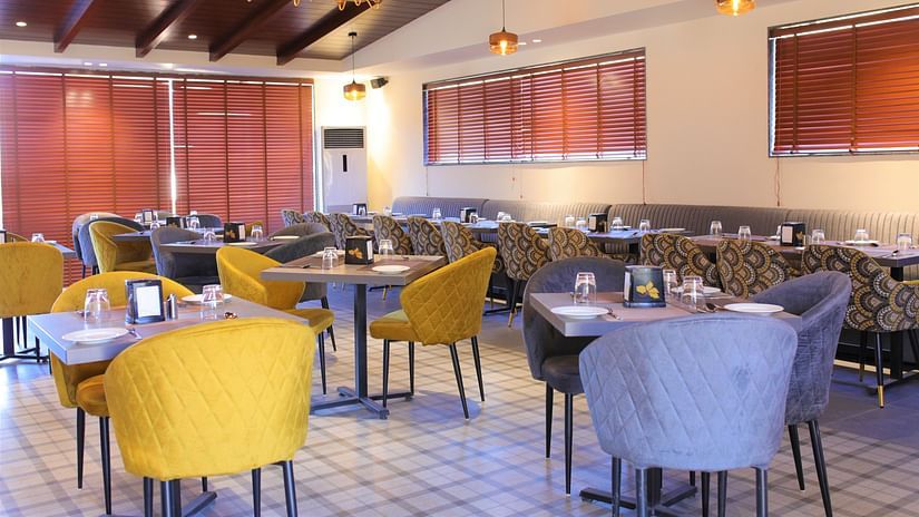 Cafe with blue and yellow comfortable and plush chairs