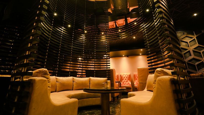 single seater sofas inside Lounge at Alchemy, our in-house bar in Chennai - Raj Park Hotel, Chennai