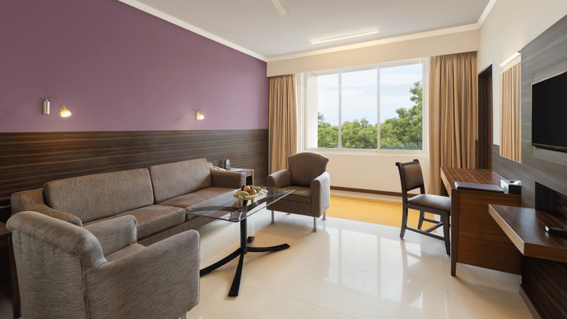 An overview of the living room in the Suite at Sangam Hotel, Thanjavur - Thanjavur Hotel Location